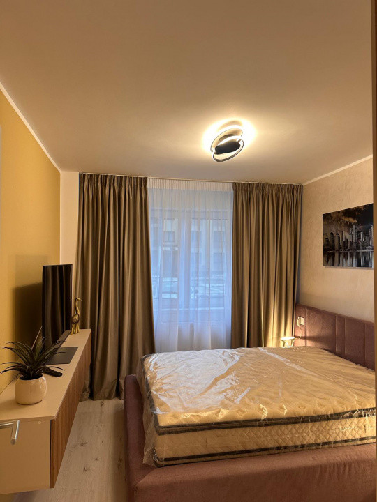 Apartament 2 camere 56 mp, cu balcon si loc de parcare, situat in Tractorul